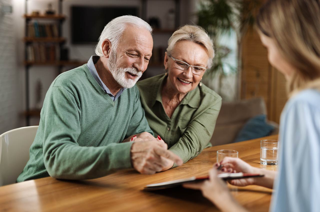 couple meeting with financial advisor to discuss keys to a successful retirement